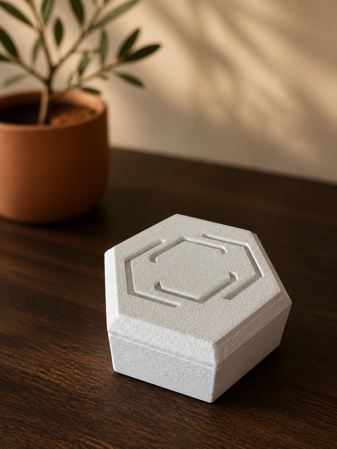 Angled view of the Pestr Alarm Hub on a walnut desk